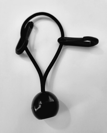 Black elastic bungee cord with plastic ball and hook ends on white background.